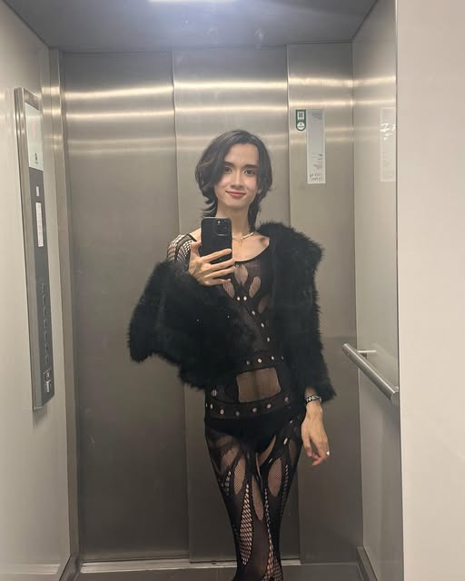 Alex in a black party look